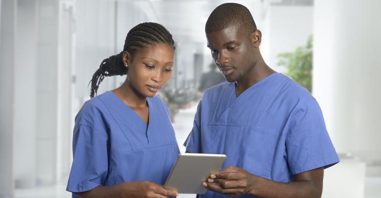 two-doctors-looking-at-tablet.jpg